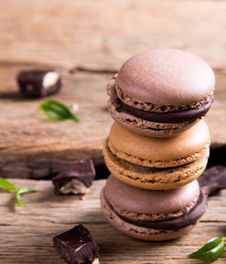 brown chocolate macaroons stacked on each other